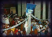Giant puppet looms over audience